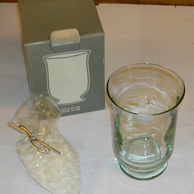 Glass med stearinkuler og veke